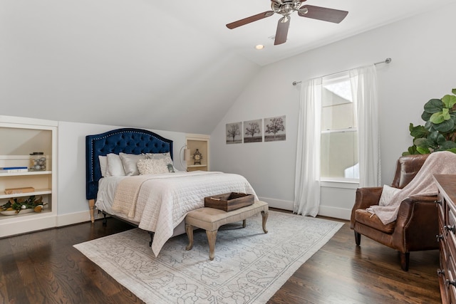 bedroom with ceiling fan, vaulted ceiling, and hardwood / wood-style floors