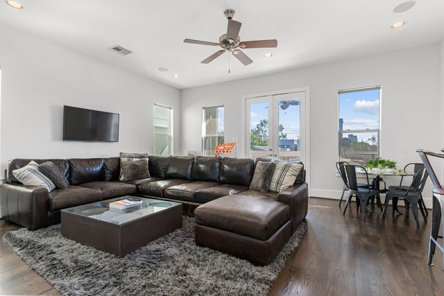 living room with french doors, ceiling fan, and dark wood-type flooring