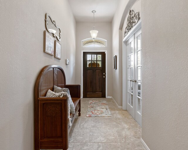 foyer entrance featuring french doors