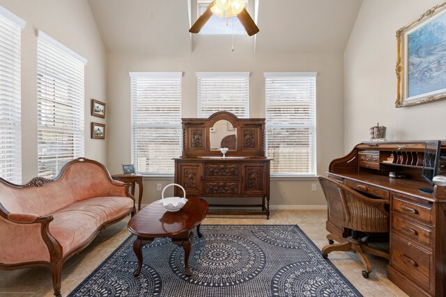 sitting room with lofted ceiling, ceiling fan, light tile patterned floors, and plenty of natural light