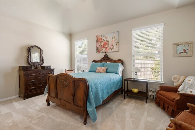 carpeted bedroom with multiple windows