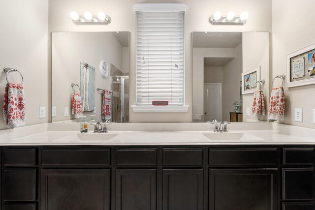 bathroom featuring vanity and an enclosed shower