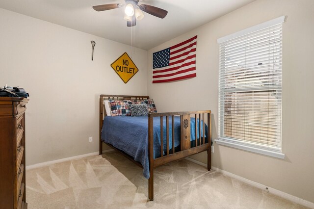 carpeted bedroom with ceiling fan