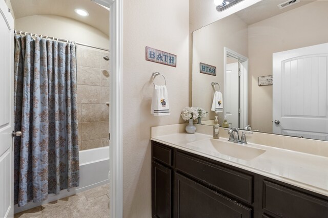 bathroom featuring vanity, tile patterned floors, and shower / bath combination with curtain