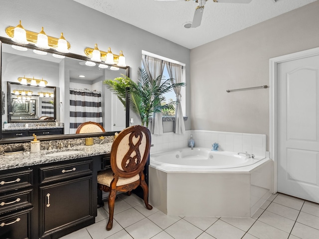 bathroom with vanity, a textured ceiling, and tile patterned floors