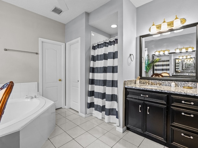 bathroom featuring tile patterned floors, vanity, shower with separate bathtub, and a textured ceiling