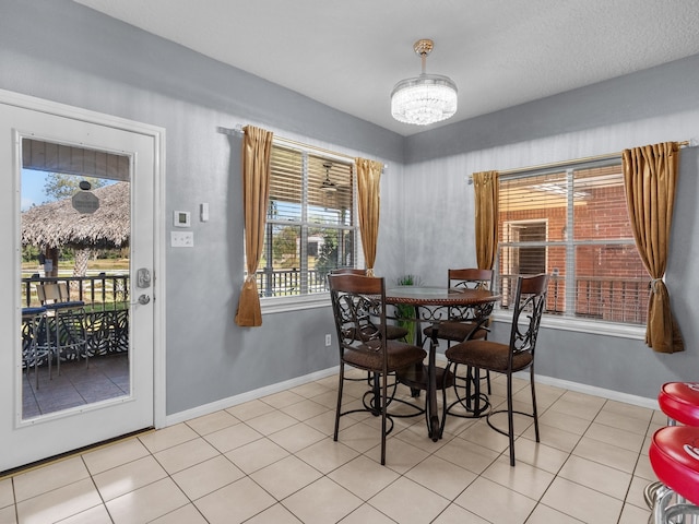 dining space featuring light tile patterned floors