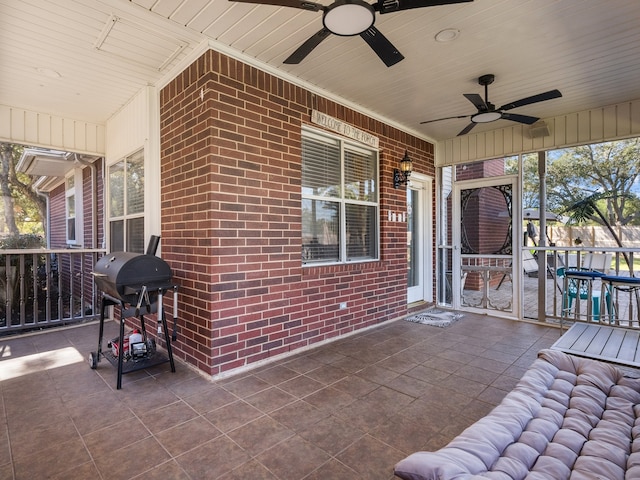 view of patio / terrace with area for grilling, ceiling fan, and covered porch