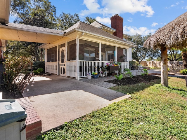 exterior space featuring a front yard and a patio area