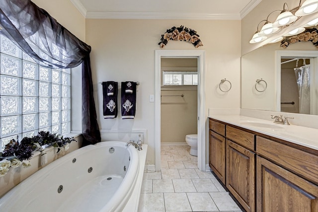 bathroom featuring ornamental molding, vanity, a tub to relax in, and toilet