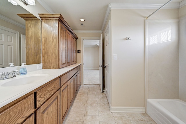 bathroom featuring ornamental molding, bathtub / shower combination, tile patterned floors, and vanity