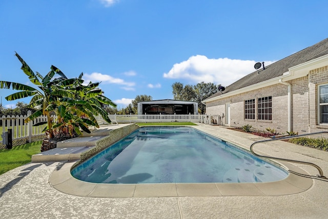 view of swimming pool featuring a patio area