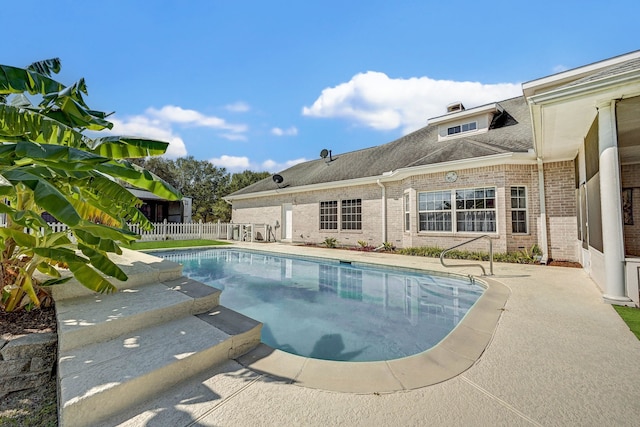 view of swimming pool with a patio