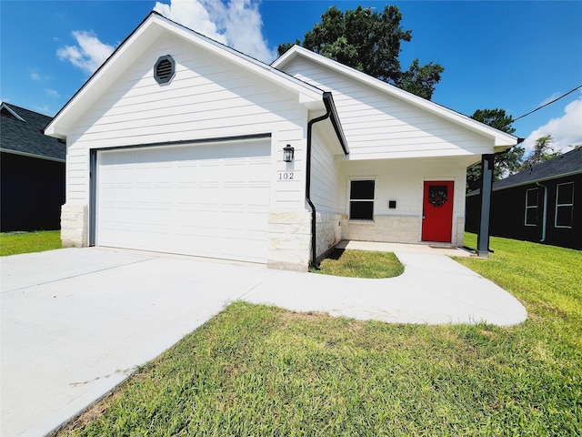 single story home featuring stone siding, an attached garage, driveway, and a front lawn