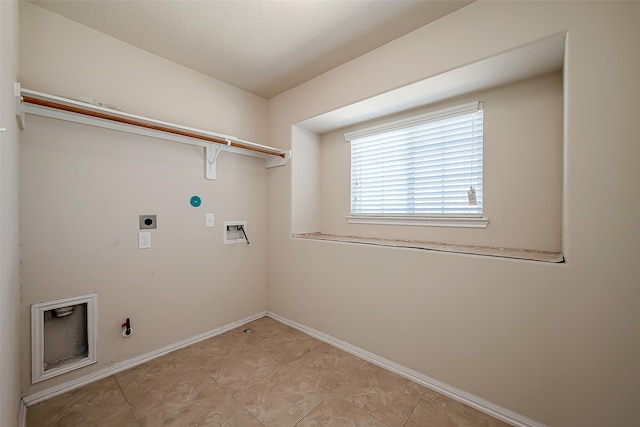 washroom featuring electric dryer hookup, gas dryer hookup, light tile patterned floors, and hookup for a washing machine