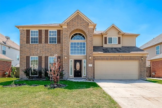 view of front of home featuring a front lawn and a garage