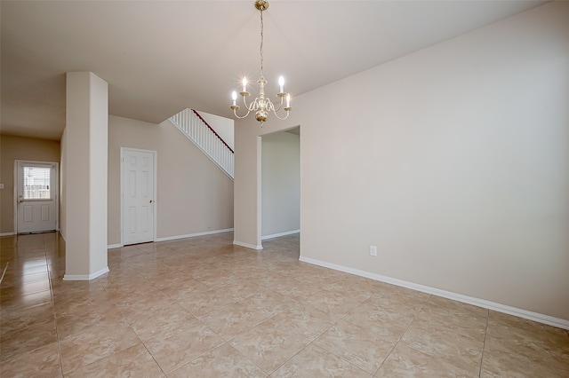 unfurnished dining area with an inviting chandelier