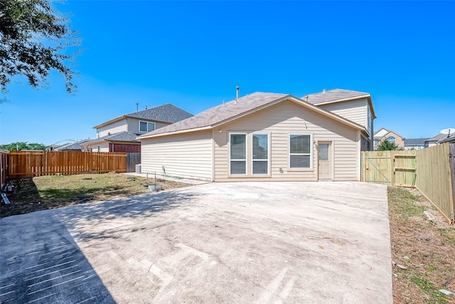 rear view of property featuring a patio