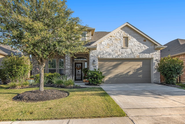 view of front of property featuring a garage and a front yard