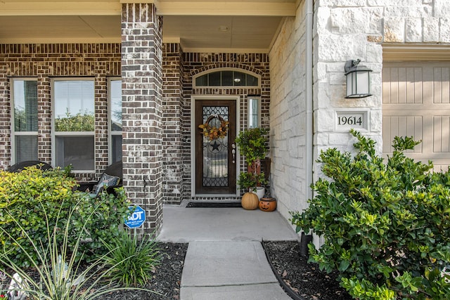 property entrance featuring covered porch