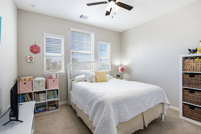 carpeted bedroom with ceiling fan