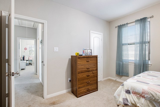 bedroom with light carpet