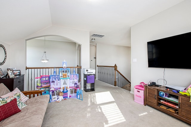 rec room with lofted ceiling and light carpet