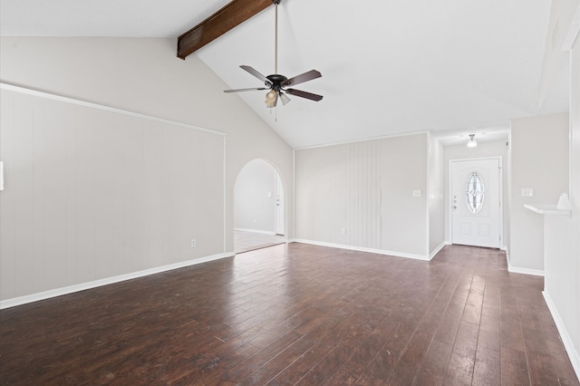 unfurnished living room with ceiling fan, lofted ceiling with beams, and dark hardwood / wood-style flooring