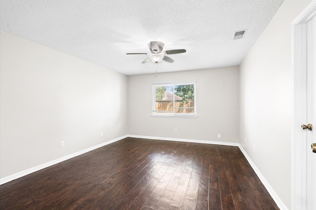 unfurnished room featuring a textured ceiling, ceiling fan, and dark hardwood / wood-style flooring