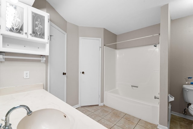 full bathroom featuring tile patterned floors, vanity, shower / tub combination, and toilet