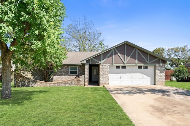 tudor home with a front lawn and a garage