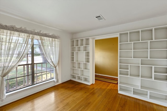 unfurnished room featuring wood-type flooring