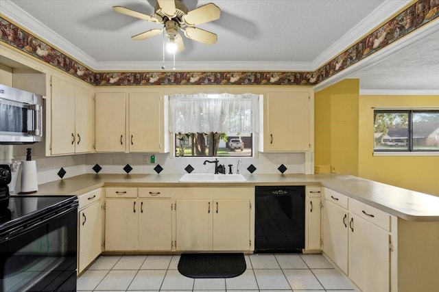 kitchen featuring black appliances, kitchen peninsula, sink, and cream cabinetry