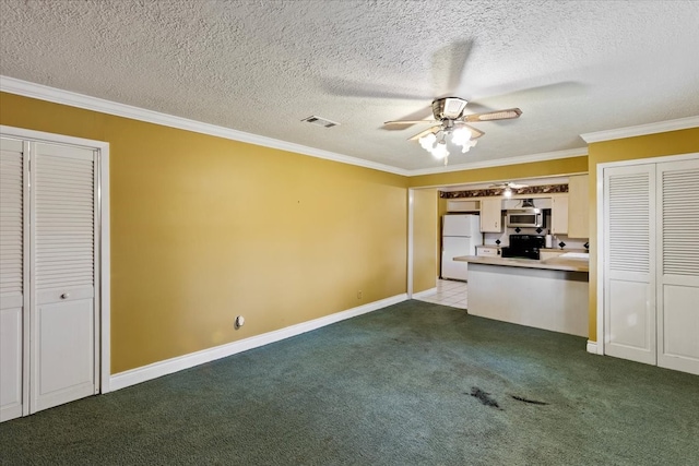 interior space with ceiling fan, light colored carpet, a textured ceiling, and ornamental molding