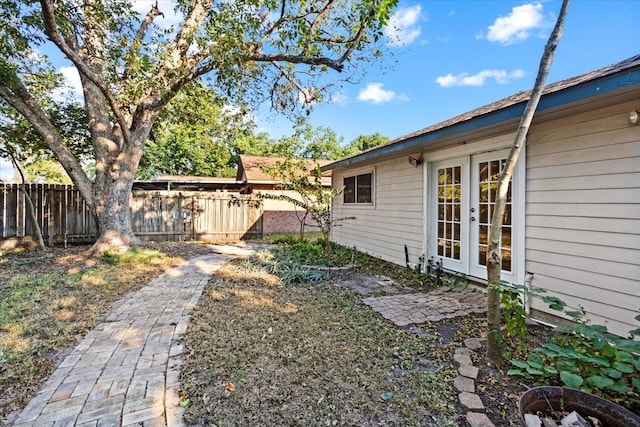 view of yard featuring french doors