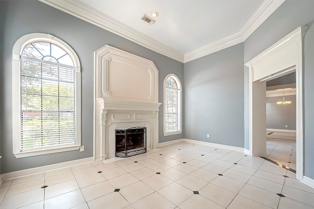 unfurnished living room with a tiled fireplace, a healthy amount of sunlight, an inviting chandelier, and ornamental molding