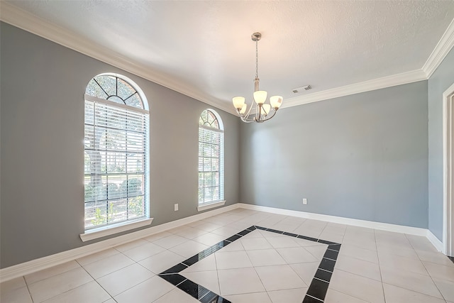 tiled empty room featuring plenty of natural light, an inviting chandelier, crown molding, and a textured ceiling