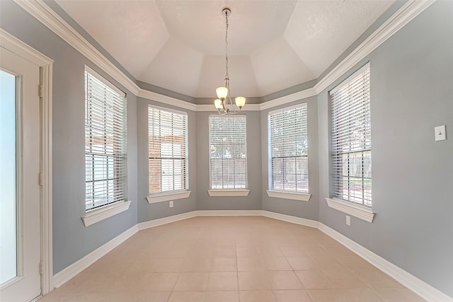 unfurnished dining area featuring lofted ceiling, a chandelier, light tile patterned floors, and crown molding