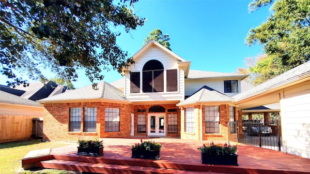 back of property featuring french doors and a wooden deck