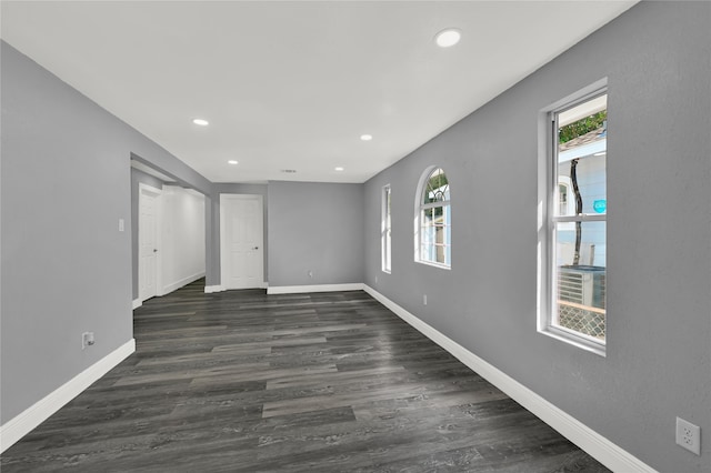 unfurnished room featuring dark hardwood / wood-style floors