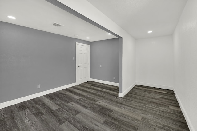 empty room featuring dark wood-type flooring