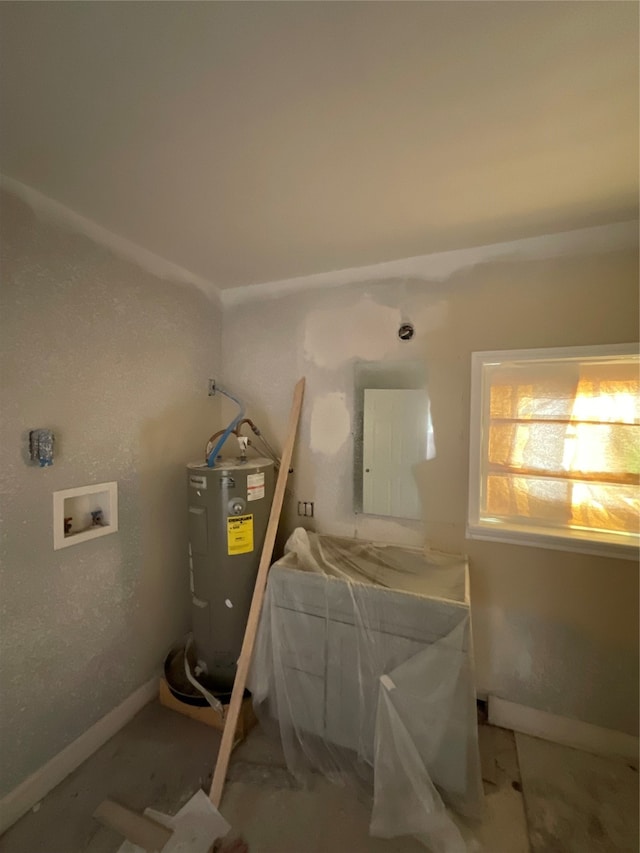 interior space with washer hookup and electric water heater