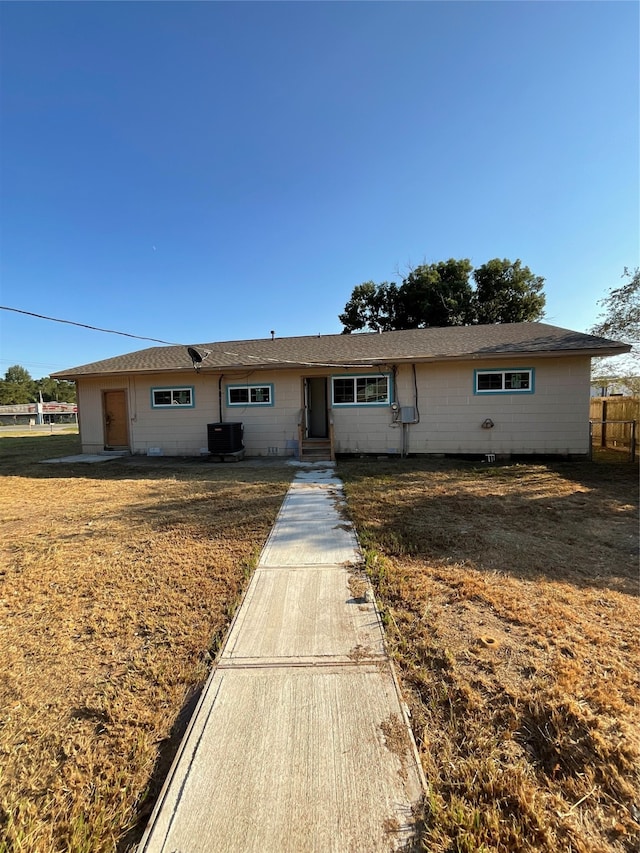 single story home featuring central AC unit