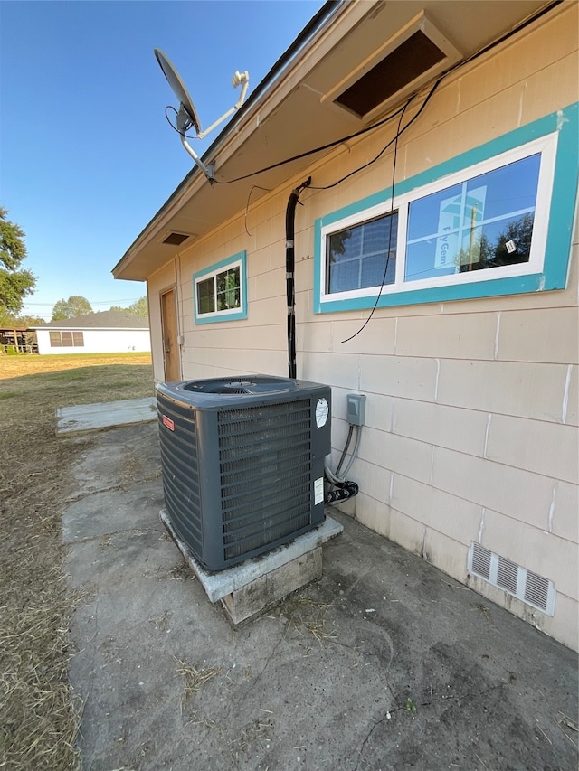 details with central AC unit and concrete floors