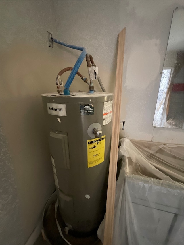 utility room with water heater