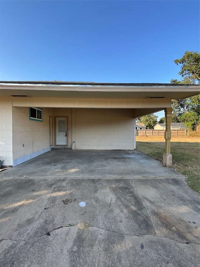 view of parking with a carport