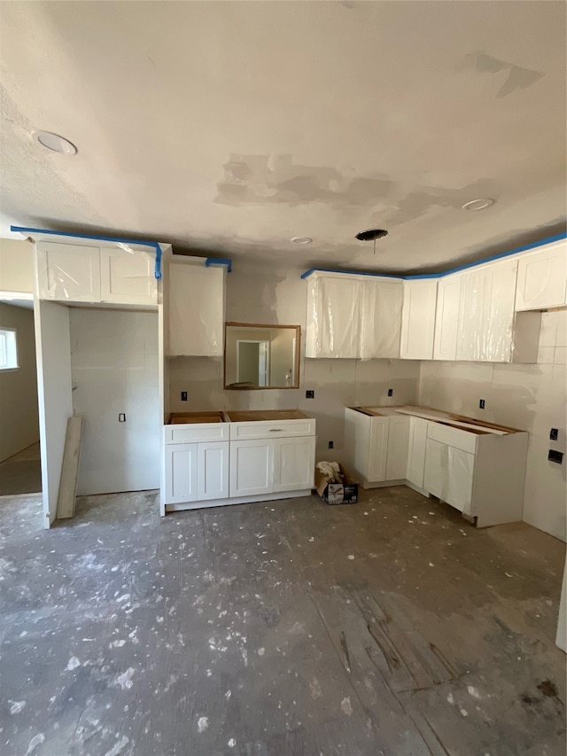 kitchen featuring white cabinets