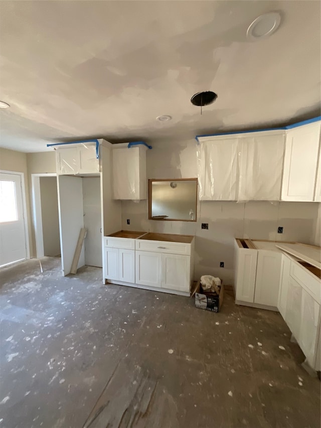 kitchen featuring white cabinets