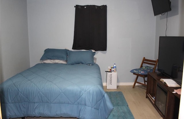 bedroom with light hardwood / wood-style floors