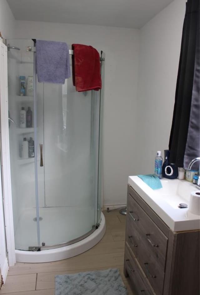 bathroom with vanity and walk in shower